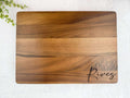 Wooden cutting board with 'Rives' engarving on a white background
