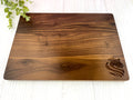 Wood cutting board with logo engraved on the lower left