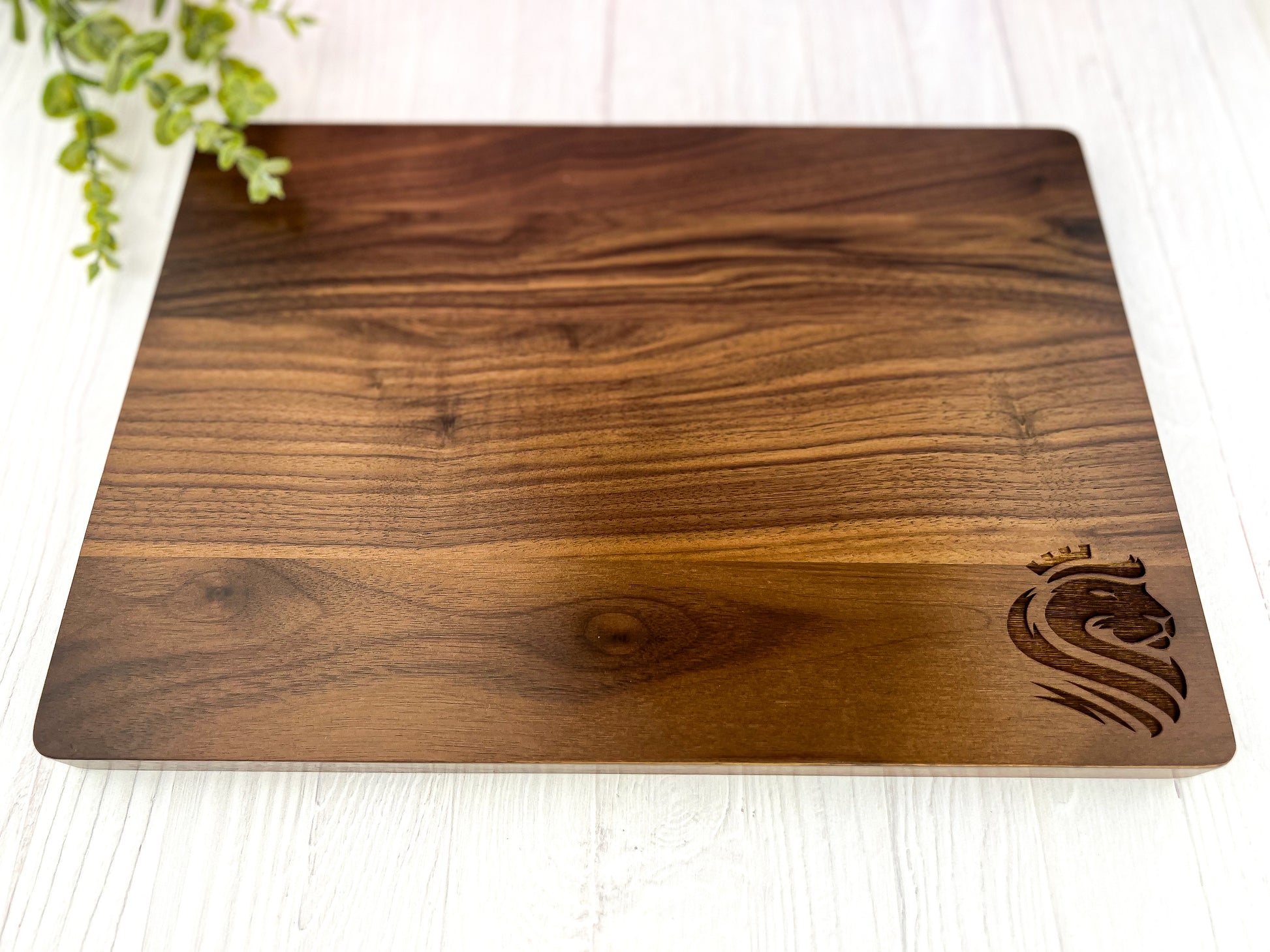 Wood cutting board with logo engraved on the lower left