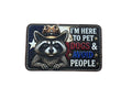 Patch with a raccoon wearing a cowboy hat and text 'I'm here to pet dogs & avoid people' on a white background