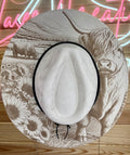 Stone color cowboy hat with band on the crown featuring a highland cow and sunflower design.
