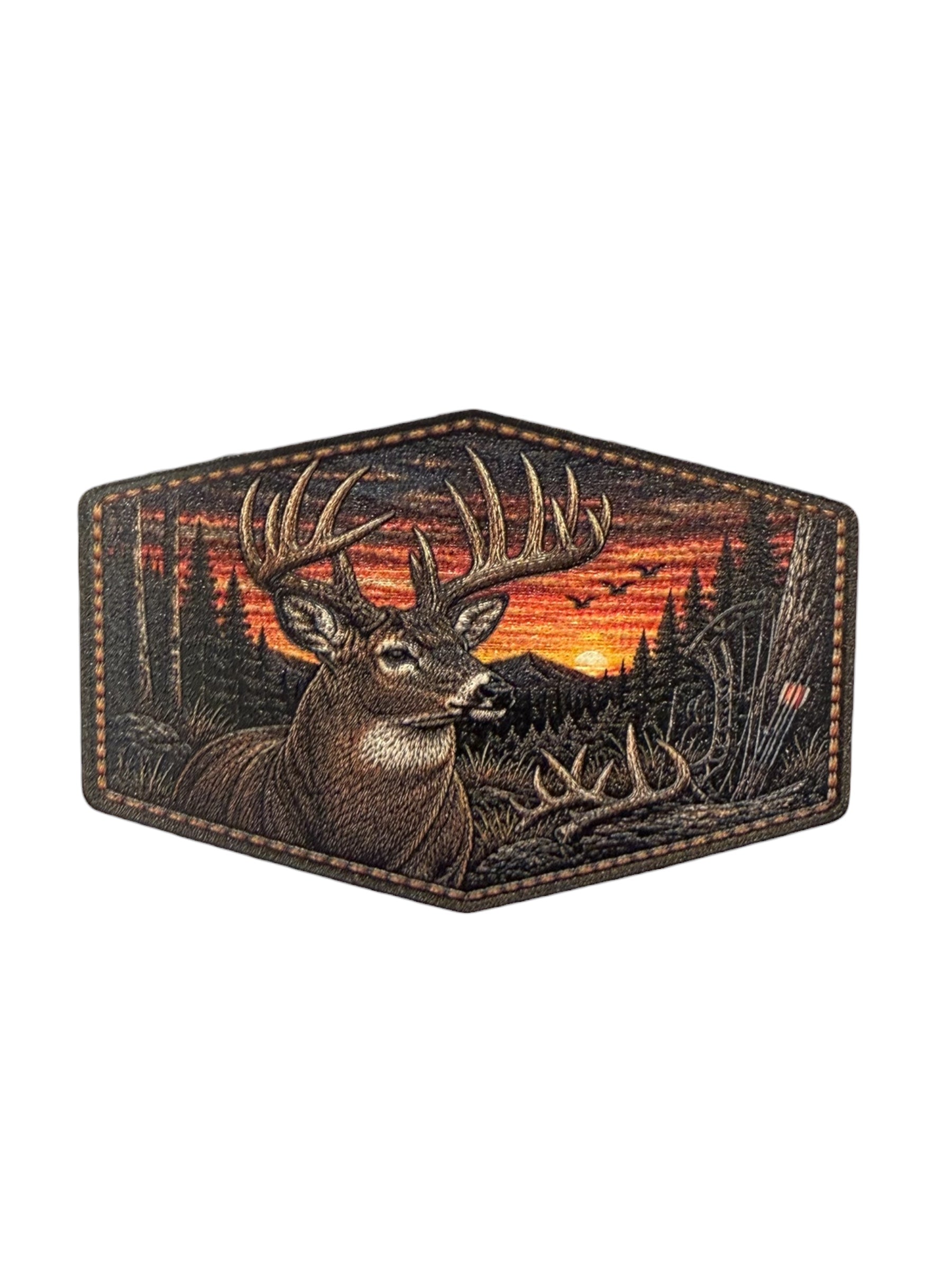 Hexagonal patch with a deer design against a sunset forest background