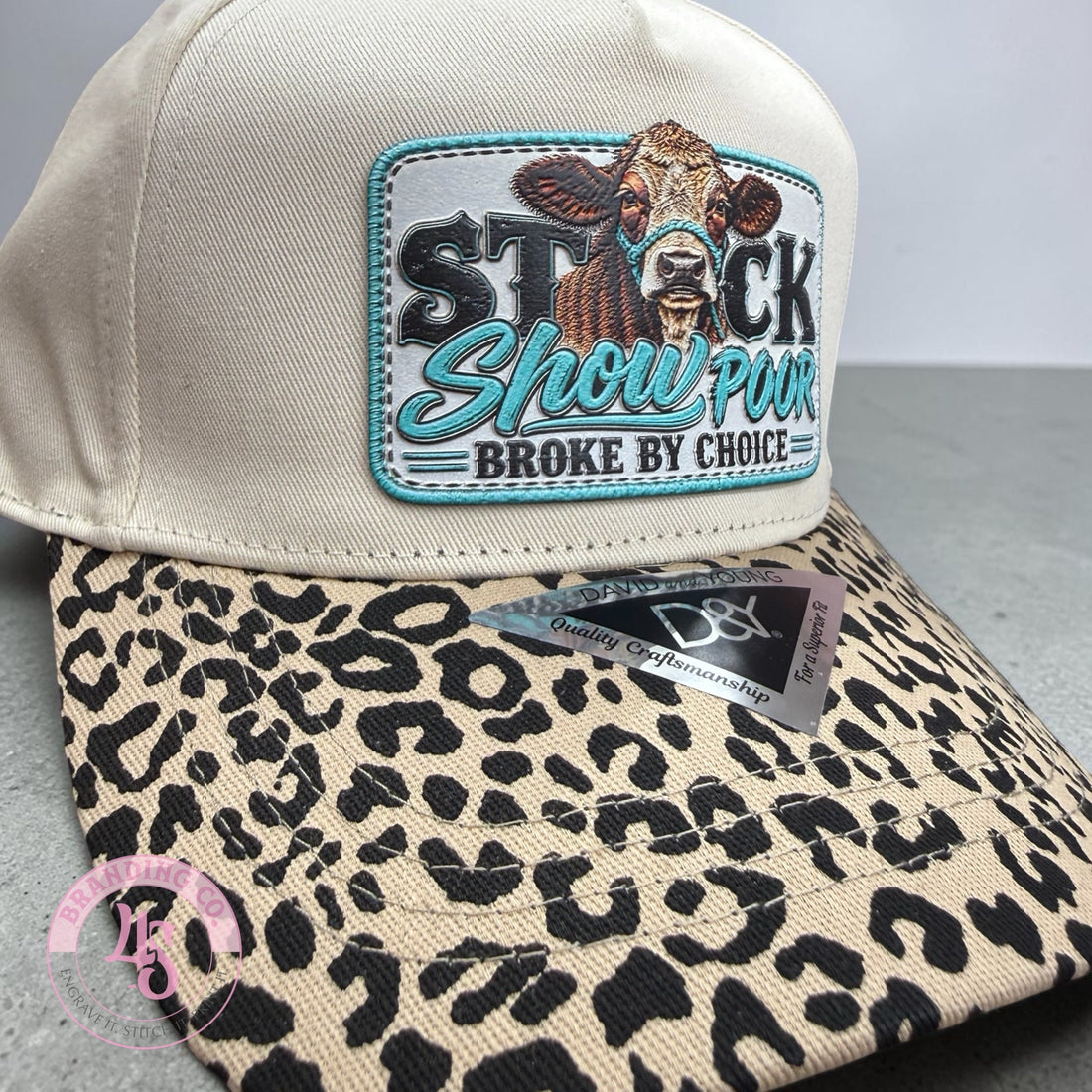 Texture build teal  cow patch on tan hat with leopard bill