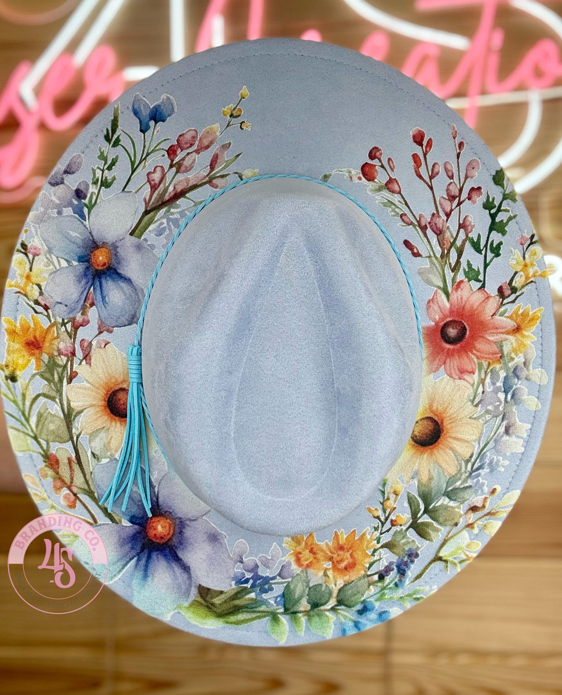 Decorative plate with floral design on a wooden surface